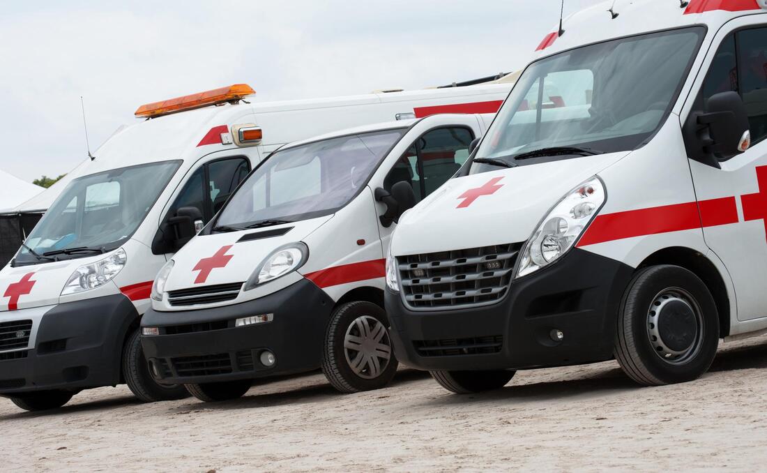a row of ambulances parked next to each other
